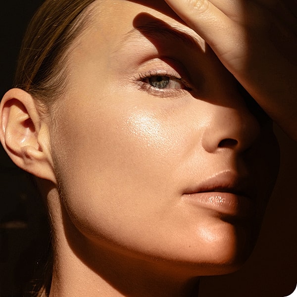 Close-up of a face in soft lighting.