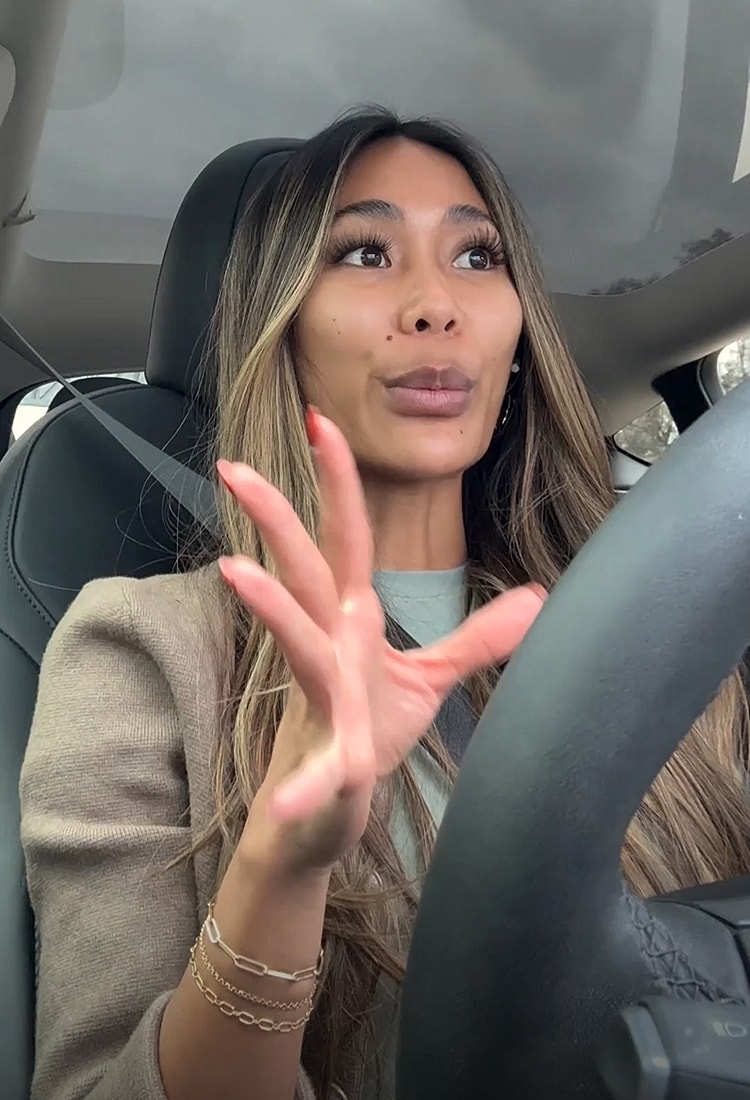 Person speaking while driving in a car.